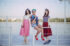 young-girls-posing-railing-seaport