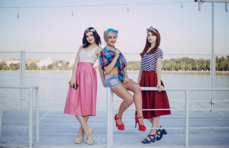 young-girls-posing-railing-seaport